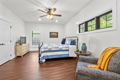 a bedroom with a bed and a ceiling fan at Bear Paws in Townsend