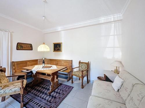 a living room with a table and a couch at Holiday Home Moselhäuschen by Interhome in Traben-Trarbach