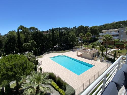an overhead view of a swimming pool in a resort at Apartment Le Domaine de la Baie-1 by Interhome in Cavalaire-sur-Mer