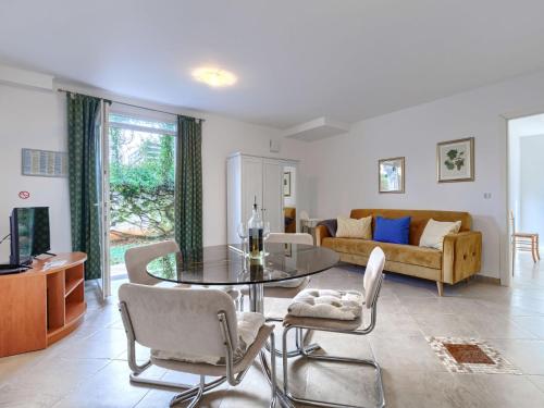 a living room with a glass table and chairs at Apartment File-6 by Interhome in Zambratija