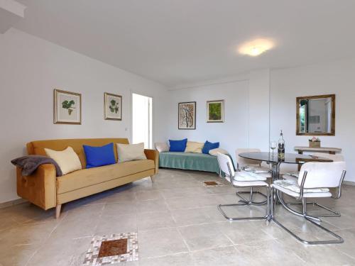 a living room with a couch and a table at Apartment File-6 by Interhome in Zambratija