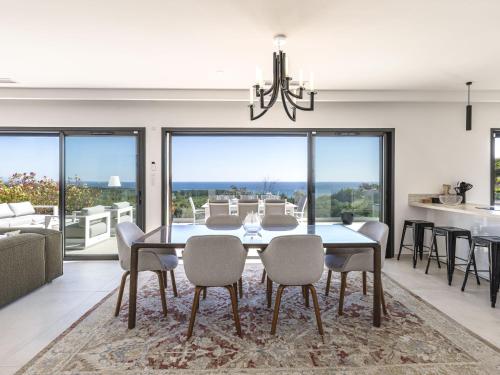 a dining room with a table and chairs at Villa Casa Minà by Interhome in Sari Solenzara
