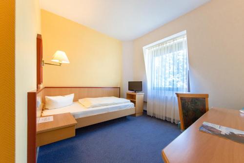 Postel nebo postele na pokoji v ubytování Montana Hotel