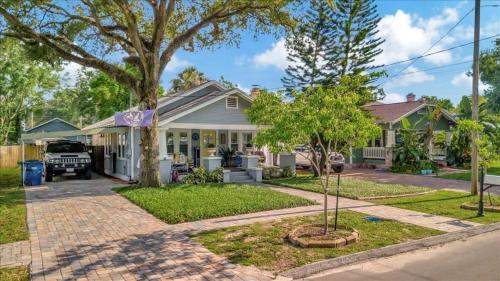 a house with a parking meter in front of it at Rivercrest Bungalow Retreat in Tampa