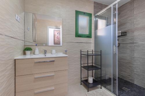 a bathroom with a sink and a shower at Casita Darmelo in Costa Calma