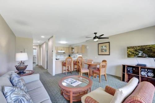 a living room with a couch and a table at Kauai Serenity Condo Pono Kai Resort E206 in Kapaa