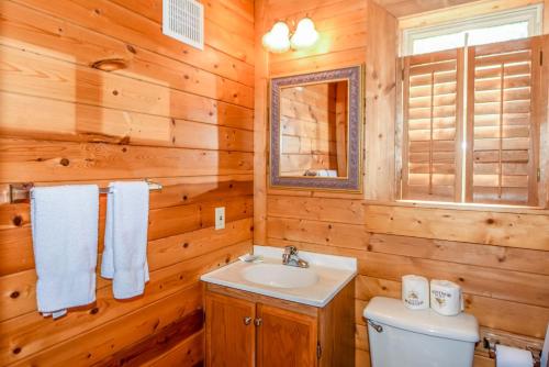 a bathroom with a sink and a toilet at Serenity in Townsend