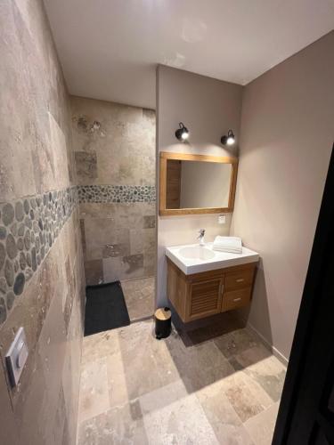 a bathroom with a sink and a mirror at Maquis in Mialet