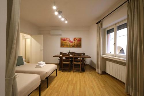 a room with a table and a dining room at Wine Apartments Florence Malvasia in Florence