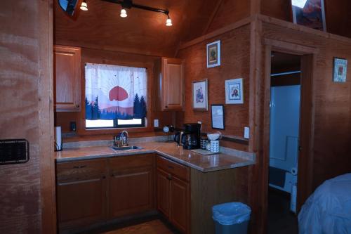 a kitchen with a sink and a window at Dumplin Patch Bed & Breakfast in Williams