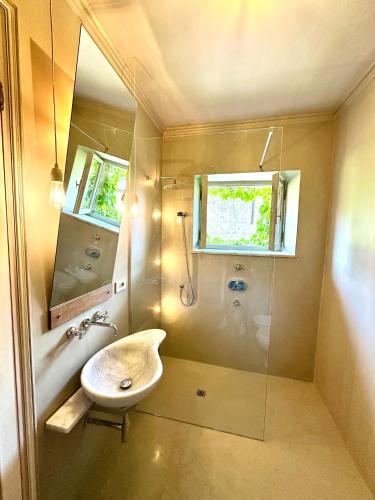 a bathroom with a sink and a shower at B&B A Piazza del Gesù in Viterbo