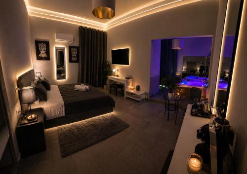 a bedroom with a large bed and a room with a bed at Duomo Luxury Suite Catania in Catania