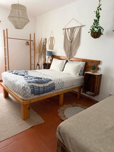 a bedroom with a bed in a room at Casa do Mar - Nazaré Big Wave Spotter House in Nazaré