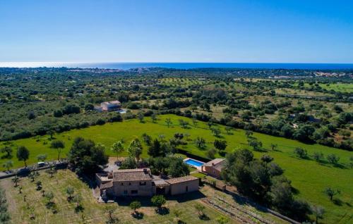 an aerial view of a house in a field at Can Moleta in Cala Mendia