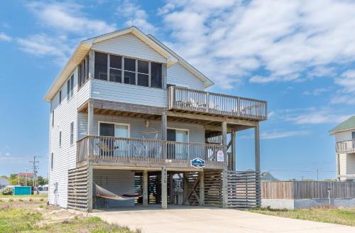 a house on the beach with a balcony at Carolina Kai, Kitty Hawk MP 3, 275 Yds to Beach, Ocean View, Pool, Hot Tub, Flex Stays in Kitty Hawk