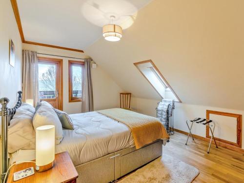a bedroom with a large bed and a window at 3 Bed in Gordon oc-82788 in Gordon