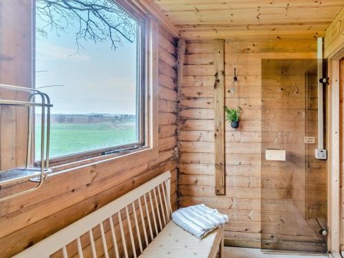 a wooden room with a window and a bench at 3 Bed in Gordon oc-82788 in Gordon