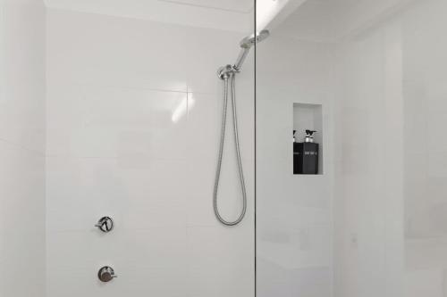 a shower in a bathroom with a shower at Bayview Nook Tanilba Bay in Lemon Tree Passage
