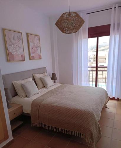 a bedroom with a bed and a large window at Jazmin ID300 in Villanueva de Río Segura