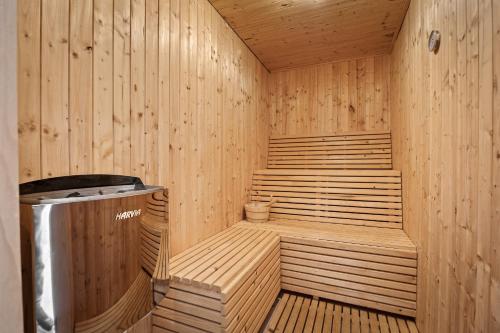 a wooden sauna with a trash can in it at Villa Martha in Central Istria with private pool - wellness & table tennis for 12 persons in Žminj