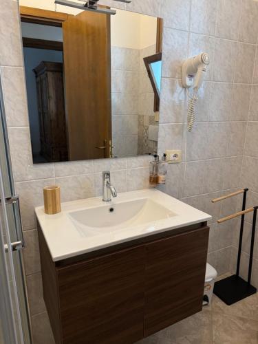 a bathroom with a sink and a mirror at Masseria Fagà in Otranto