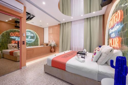 a hotel room with a bed and a sign on the wall at La Casa Mexicana in Alfortville