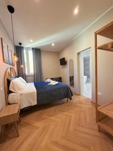 a bedroom with a bed and a large window at Velvet Rooms Florence in Florence
