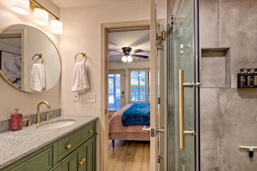 a bathroom with a shower and a bed at Alpine Studio in Helen