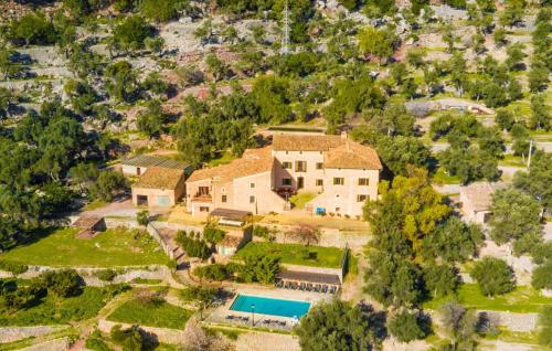 an aerial view of a house with a swimming pool at Biniforani Nou in Bunyola
