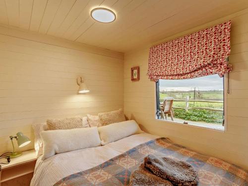 a small bedroom with a bed and a window at 2 Bed in Lutterworth oc-93762 in Boughton
