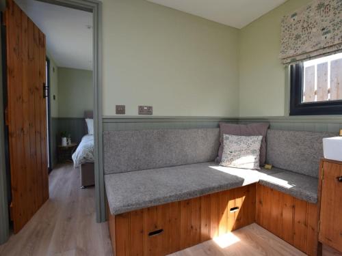 a couch in a room with a window at 1 Bed in Hawarden oc-93595 in Hawarden