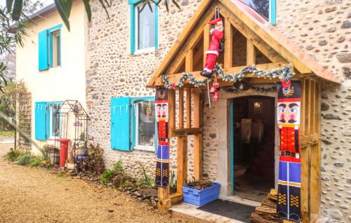 a house with a christmas decoration on the front at Awesome Home In Charritte-De-Bas With Wifi in Charritte-de-Bas