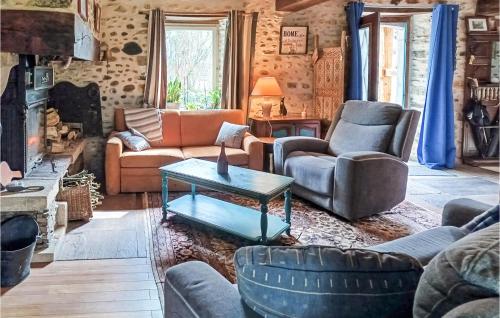 a living room with couches and chairs and a table at Awesome Home In Charritte-De-Bas With Wifi in Charritte-de-Bas