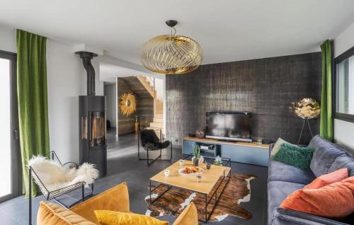 a living room with a couch and a table at Villa Botero Dinard in Dinard