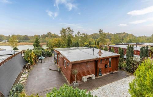 a wooden house with a roof at Nice Home In Erm With Wifi in Erm