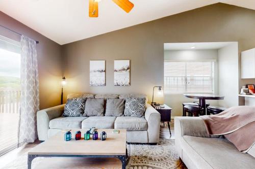 a living room with a couch and a table at Lake Adventures at Eagle's Nest in Branson