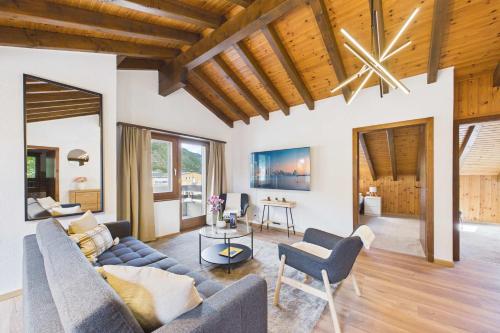 a living room with a couch and chairs at Spacious apartment in Brig-Glis in Gamsen