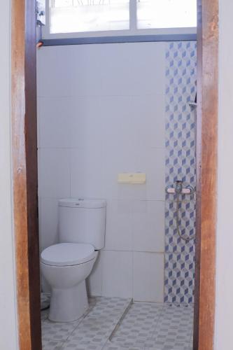 a bathroom with a toilet and a shower at Atlasio House in Kasri