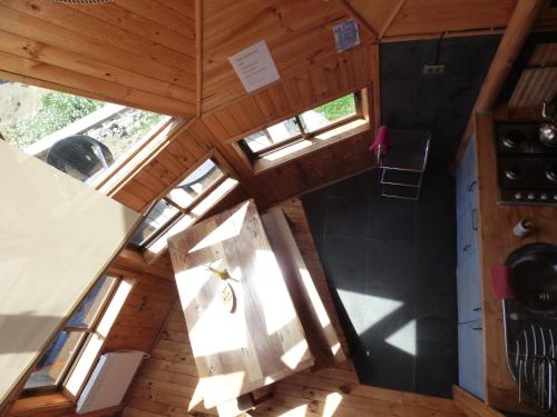 an overhead view of a kitchen in a tiny house at Dune & Domes Pichilemu in Pichilemu