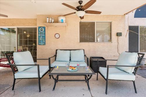 a patio with two chairs and a table at Chandler Oasis in Chandler