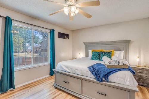 a bedroom with a bed and a ceiling fan at The KANtucky Derby Home in Derby