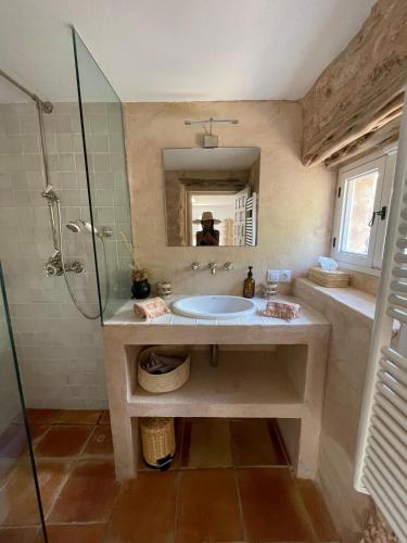 a bathroom with a sink and a shower at Finca LA SELVA, Exclusive Villa in Benimussa in San Antonio