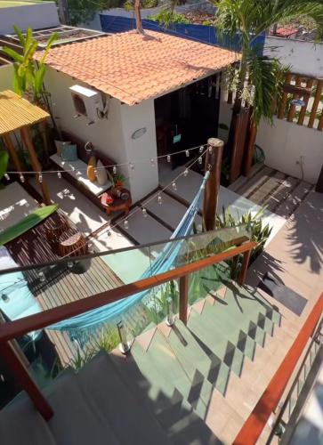 an overhead view of a house with a swimming pool at Pousada Praiana in Porto De Galinhas
