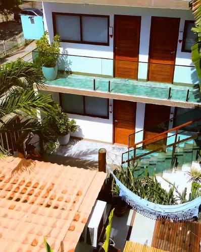 an overhead view of a building with a swimming pool at Pousada Praiana in Porto De Galinhas