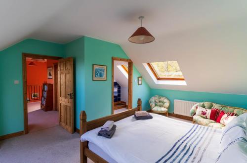a bedroom with a bed in a room with green walls at An Charraig in Killarney