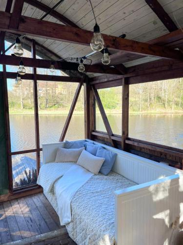 a bed on the back of a boat at Isans stuga in Broby