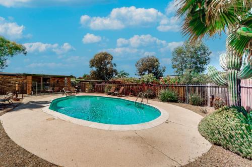 a swimming pool in a yard with a fence at Tranquil Trail #8 in Carefree