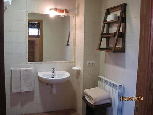 a bathroom with a sink and a mirror at La Ventana De Tejera Negra in Cantalojas