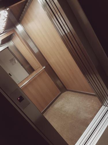 an empty closet with wooden doors in a room at Locanda del Lago Rosmunda in Clusane sul Lago