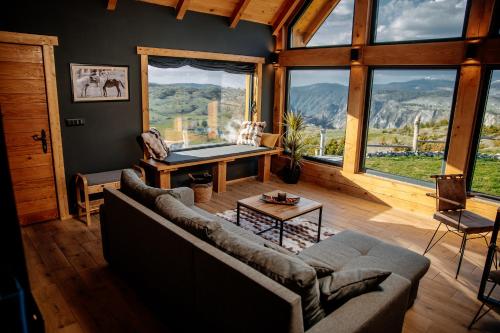 a living room with a couch and a pool table at Mountain Dream Chalet Durmitor in Nedajno